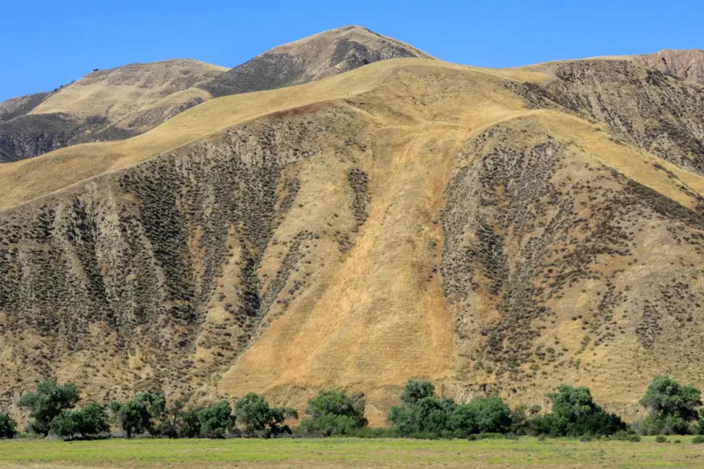 A view of rolling ranch land and open space representing rural property in San Benito County